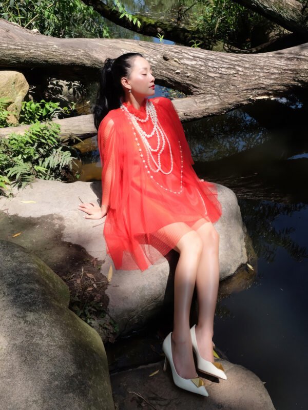 Oversized Pleated Red Tulle Top with Ruffled Neckline and Layered Pearl Necklace - Image 2